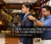 Tailor checking the shoulder fit of a custom tailored suit